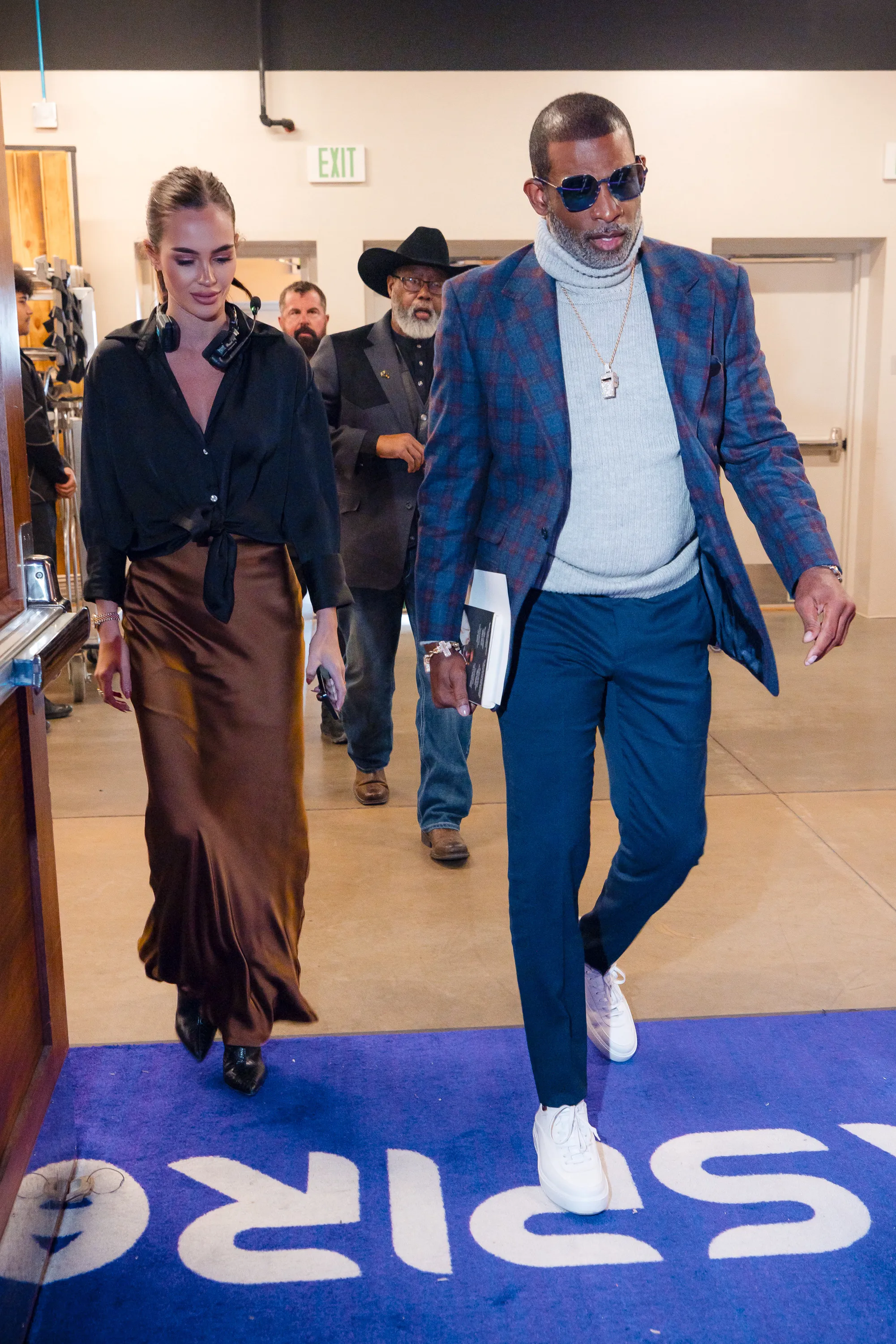 Alex with Deion Sanders